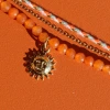 Bracelet en 3 rangs orange et doré